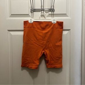 orange biker shorts
